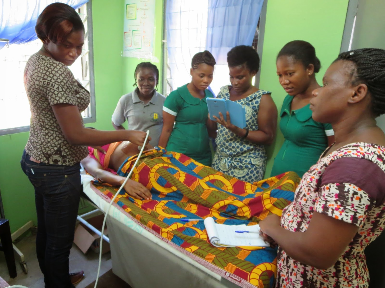 Nurses taking a scan on a pregnant woman